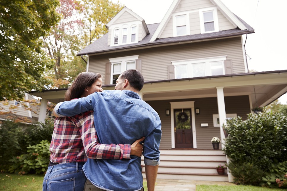 Couple admiring their home’s curb appeal