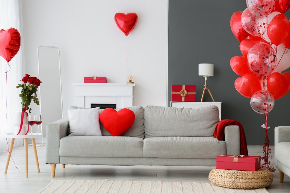 Family room decorated for Valentine's Day with heart-shaped balloons and roses